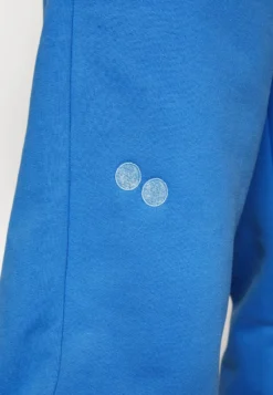 Pinqponq UNISEX - Jogginghose - Cornflower Blue -Angebote Stil Tage Store b3f19c87465f474d9ddef6bcc1aa5b71